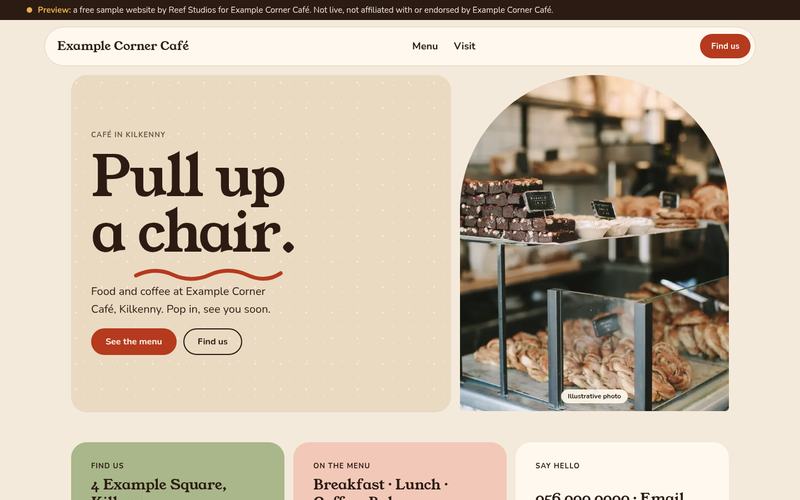Café concept on a laptop: warm serif headline 'Pull up a chair.' beside an arched photo of a pastry counter.